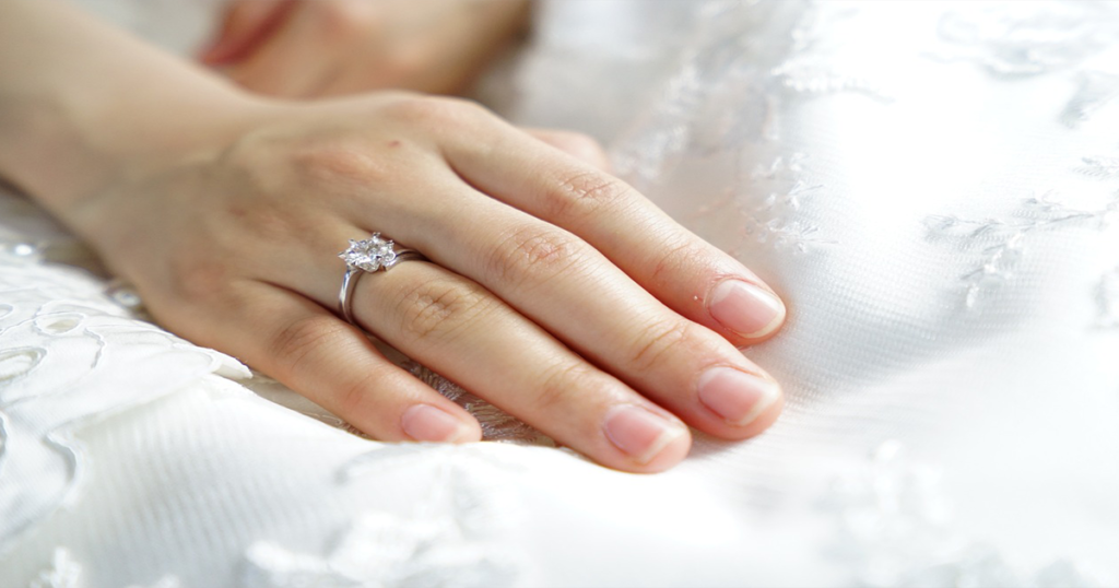 Wedding Ring With Wedding Dress Backdrop