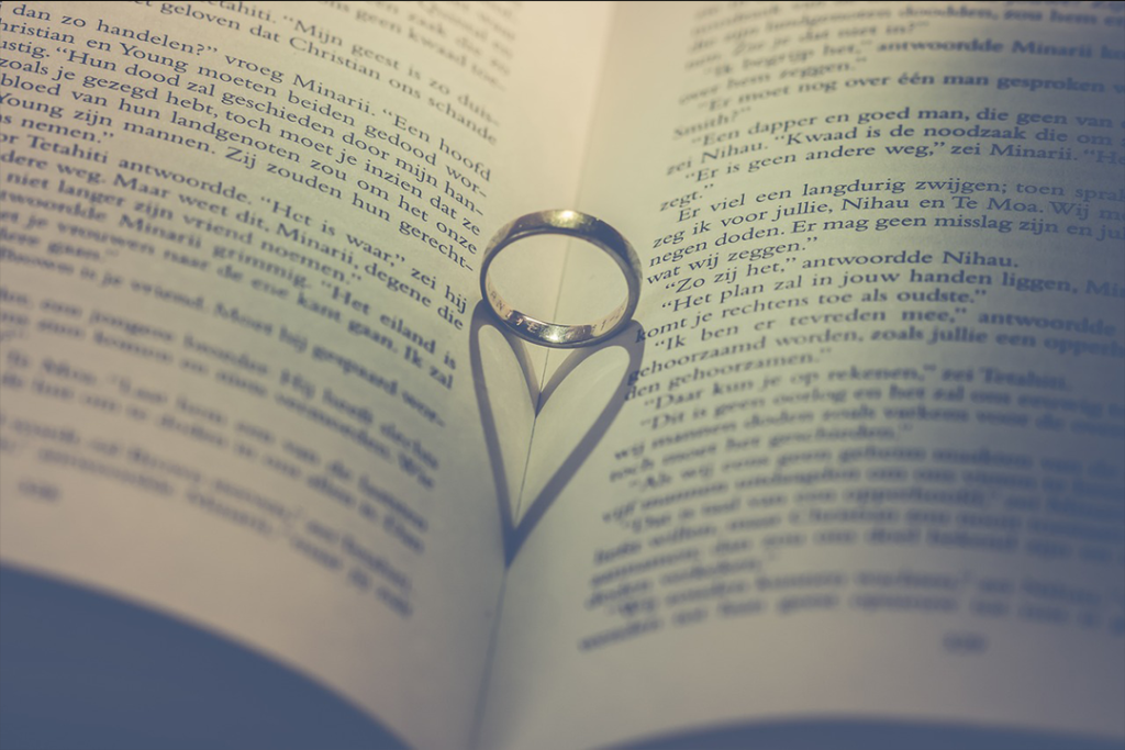 Wedding Ring on Book/Newspaper Backdrop